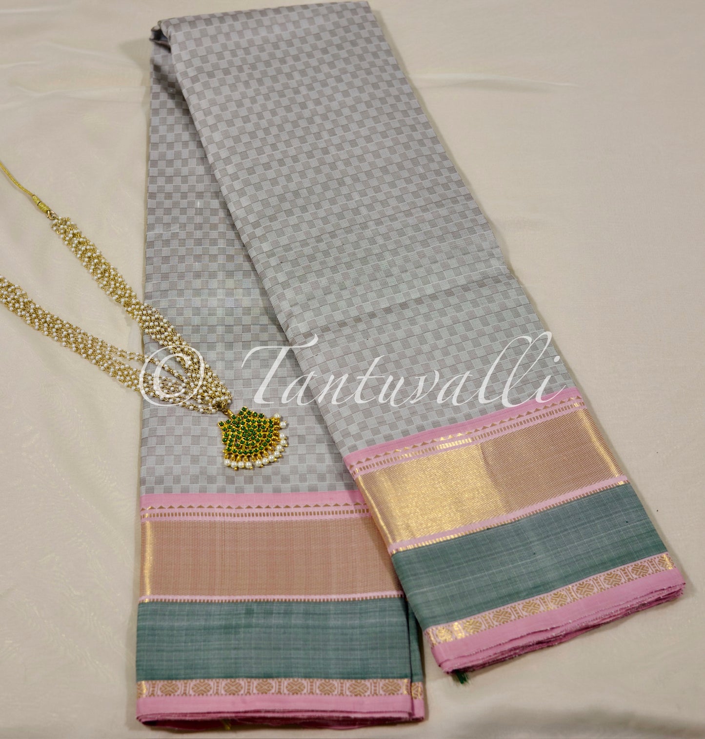 White and muted grey with Baby pink, pale green Korvai