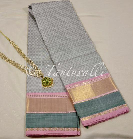 White and muted grey with Baby pink, pale green Korvai